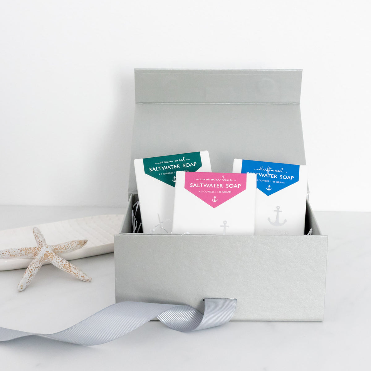 three saltwater soaps in a gift box, white background