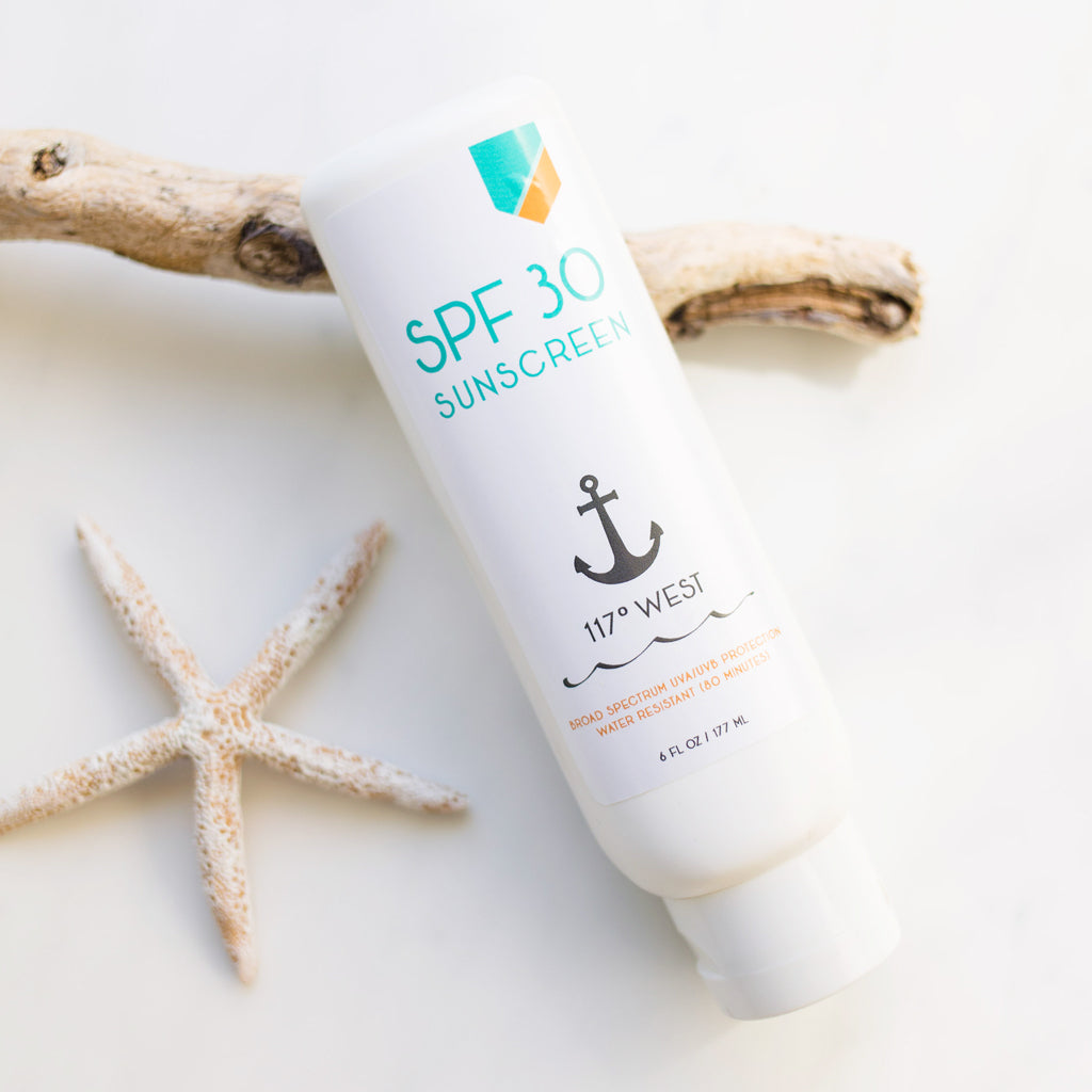 SPF 30 moisturizer with wood and a starfish in the background
