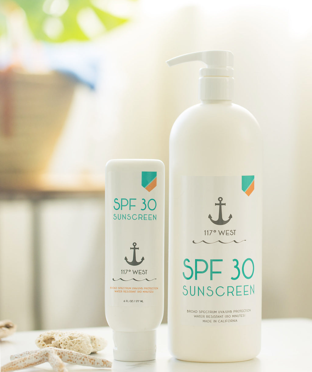 6 oz SPF 30 sunscreen and 32 oz SPF 30 sunscreen on top of a white table