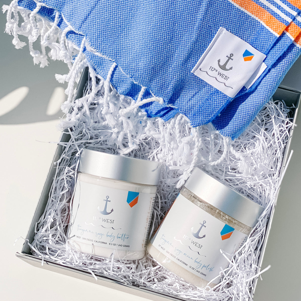 tangerine sage body butter, tangerine sage ocean body polish and a turkish beach towel in a gift box